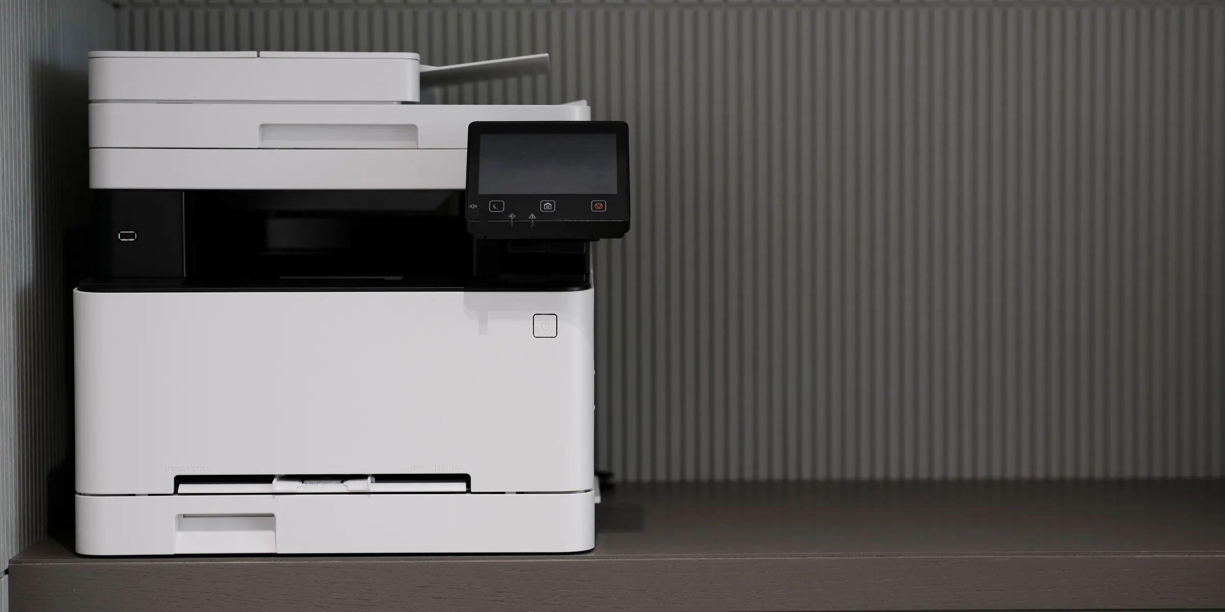 A multifunction printer on an office counter